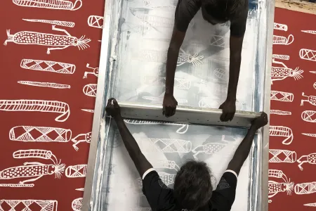 Raylene Ngarrdjdjan Bonson and Genevieve Smith screen print Bawálba, designed in 2018 by Lucy Bulandjan Yarawanga. Image reproduced courtesy of Bábbarra Women’s centre. Photograph by Ingrid Johanson, 2018. 