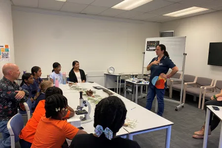 students using microscopes