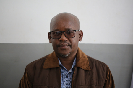 Juma Kegamba head and shoulders against plain background