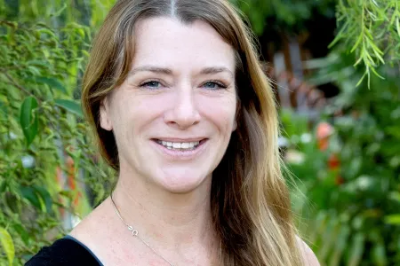 Joanne Randall head and shoulders with green leafy background