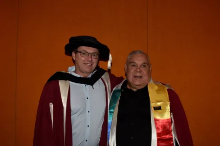 two male researchers pose for camera