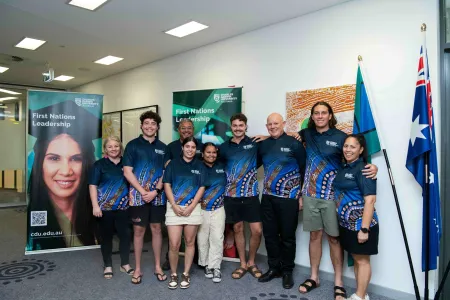 Indigenous Nationals team members pose with executives
