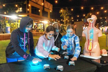 group of kids play light game