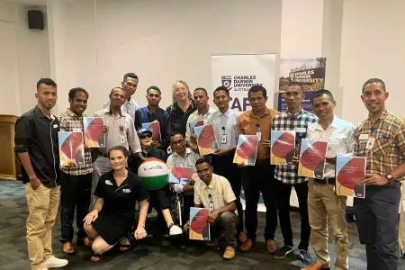 Aged Care students pose in classroom