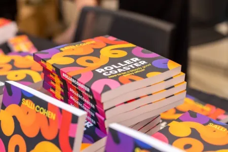 A stack of Rollercoaster: How to be a bloody good policy officer books