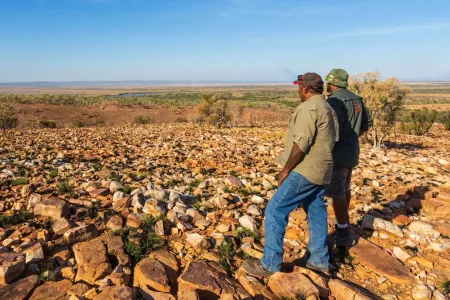 Two Indigenous Young Men Look over Country 