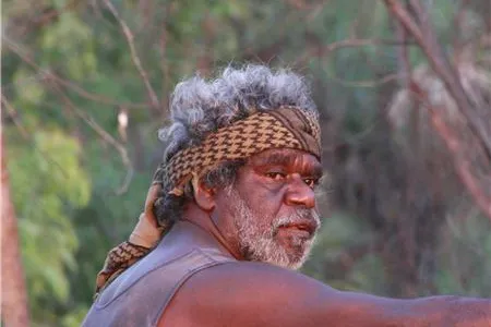 Photo of William Parmbuk infront of some trees