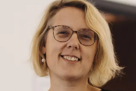 photo of woman with glasses smiling