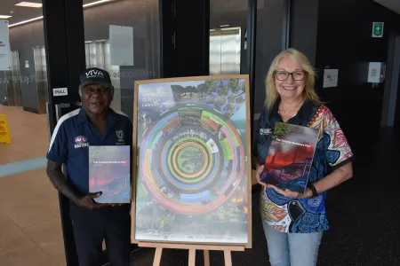 Tiwi Plantations Corporation Chair Gibson Farmer Illortaminni and CDU Northern Institute Research Associate Alicia Boyle with the Tiwi Forestry Workforce Plan 2026–2030.