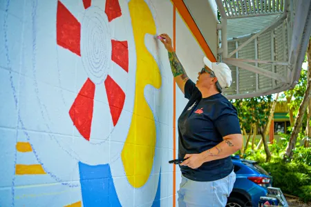 CDU First Nations Training and Teacher Education Hub Director Larissa Pickalla is one of 23 artists involved in this year’s Darwin Street Art Festival. 