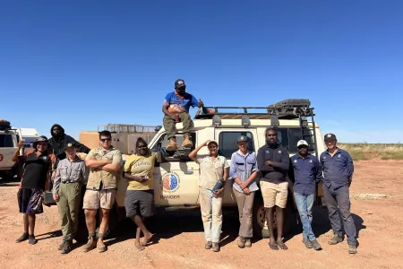 Group of people standing in front of a Landcruiser