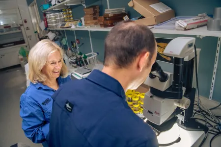 Two people are working in a lab