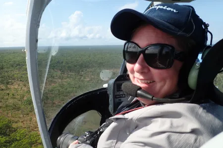 Dr Natalie Rossiter-Rachor conducts helicopter testing of a mobile application in Litchfield National Park. The app enables aerial mapping of gamba grass and other weeds at a landscape scale. Photo: NESP Resilient Landscapes Hub.