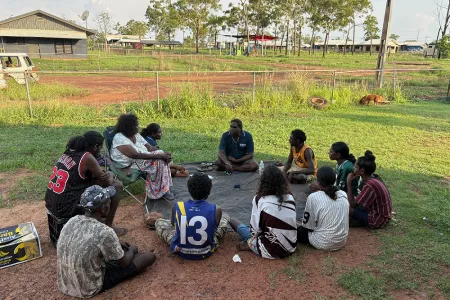 Researcher Troy Mardigan sits with a ceremony group in the West Daly region. Michaela Spencer, CC BY-NC-ND
