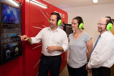   Defence Industry Minister Steven Ciobo, AMA Director Dr Rebecca Murray and CDU Vice-Chancellor Professor Simon Maddocks inspect the LightSPEE3D printer