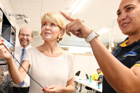 Second year electrical apprentice Nadine Braun, from Darwin, shows Foreign Minister Ms Julie Bishop and Vice-Chancellor Professor Simon Maddocks the workings of a motor simulator. 
