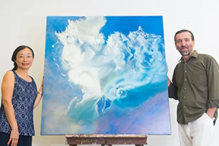 PhD candidate Isadora Mack with Senior Lecturer in Visual Arts Dr Ioannis Michaloudis and her painting, “The Spinning Top”