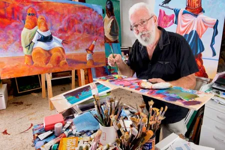 Ian Hance with a selection of his striking paintings.