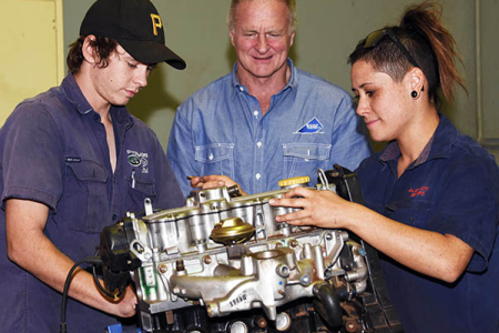 Automotive Lecturer Russ Horan (centre) with apprentices Luke McAskill and Chanel Lambert.