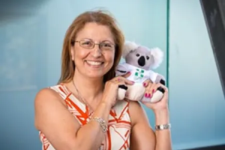 CDU Pharmacy lecturer Hana Morrissey holds mascot for mental health first aid, ALGEE the koala