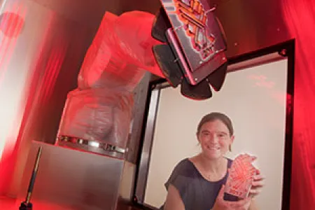 Dr Rebecca Murray shows how the copper parts of the trophies for the NT Digital Excellence Awards are created. Photo: Julianne Osborne