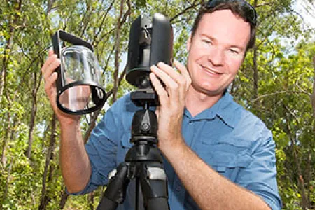 Dr Shaun Levick uses the 1kg Leica BLK360 laser scanner to map field sites that can only be accessed on foot. Photo: Julianne Osborne