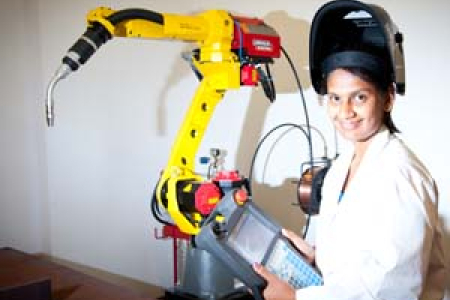 Senior technical officer Hemangi Surti controls the welding robot at NACOG