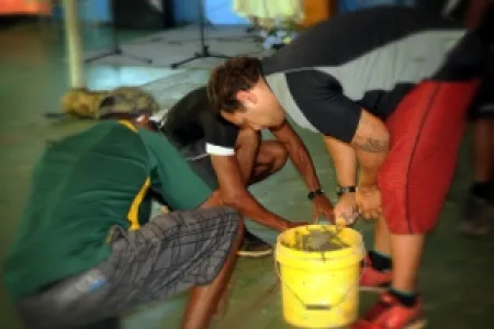 Floor exercise: Army reservists carry out repairs to the floor of Binjarri church near Katherine.