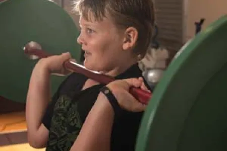 Keiryn Orr shows his technique in the Introductory Olympic Weightlifting Junior Program at CDU