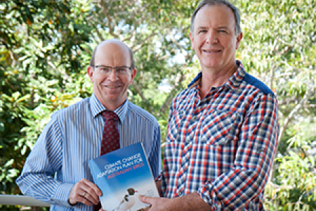 Co-editor Professor Stephen Garnett (right) says the hard work has paid off. Pictured with Vice-Chancellor Professor Simon Maddocks