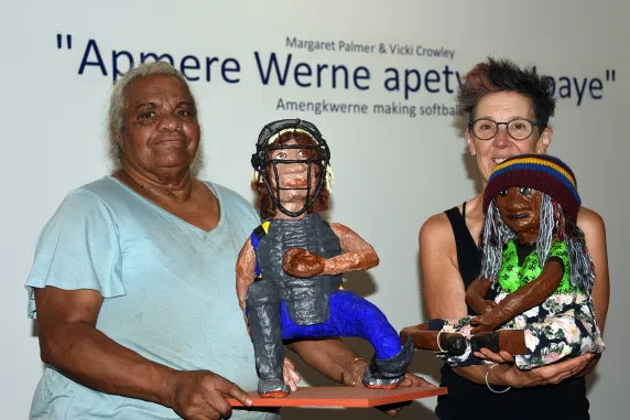 From left: Margaret Palmer and Vicki Crowley with two of the exhibition pieces: a player and one of the spectators. 