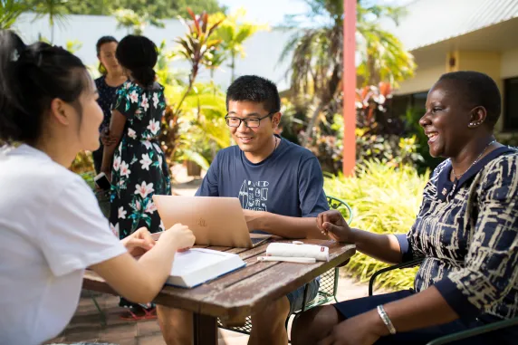 A multicultural group working to solve community problems