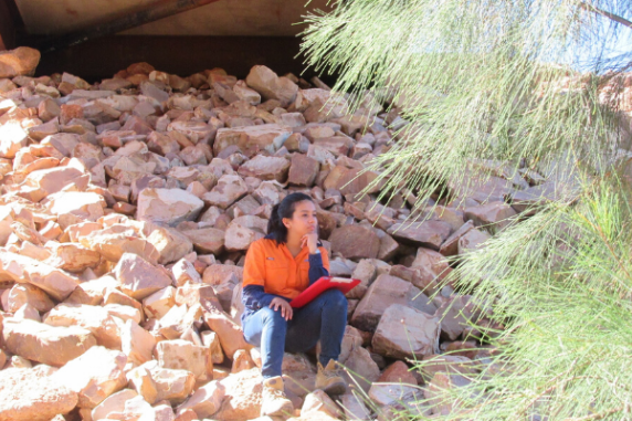CDU student Srijana Ghimire sitting on rocks