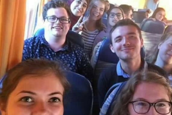 Image of William and his exchange friends on a bus