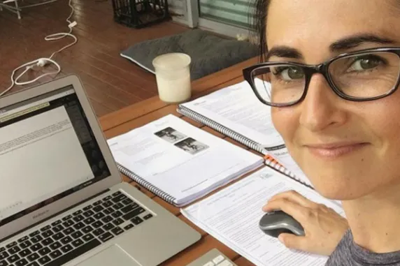 Cdu student Emma studying on a laptop