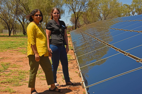 Dr Deepika Mathur (CDU) and Robin Gregory (RDA) at the solar panel array at the Desert Knowledge Australia precinct in Alice Springs.