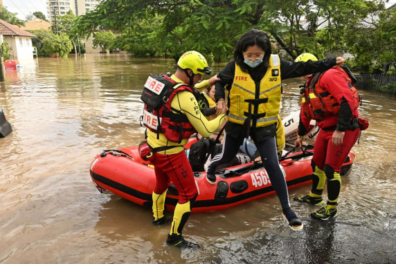 Image of students being rescued from flood waters