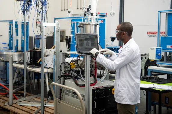 person working on computer in organic electronics laboratory