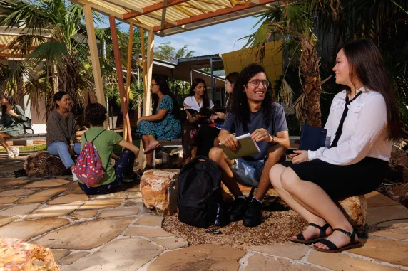 Group of students sitting and talking with each other