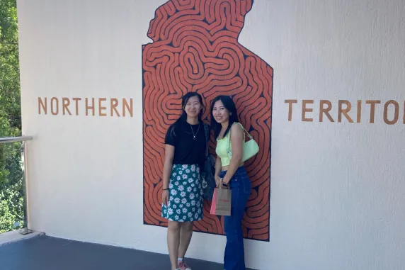 Ayumi in front of NT sign