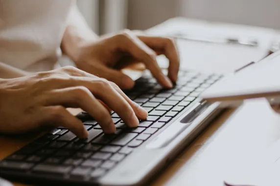 Image of hands using a keyboard