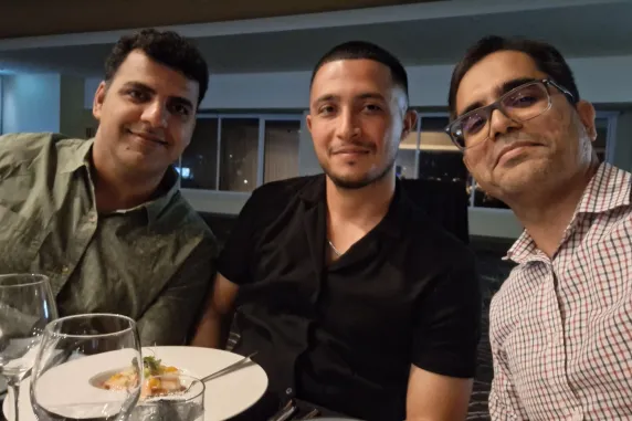 3 men looking at the camera