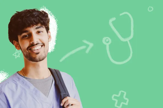 young man in nursing scrubs looking at the camera