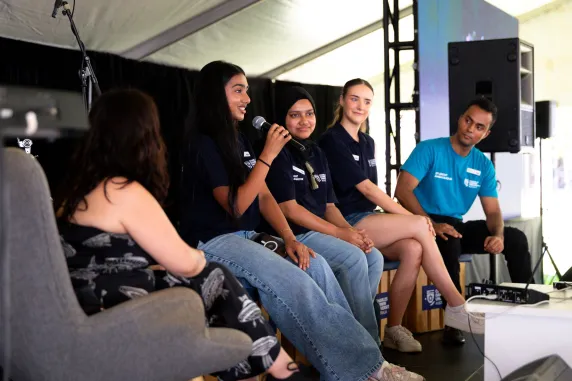 panel of student ambassadors on stage