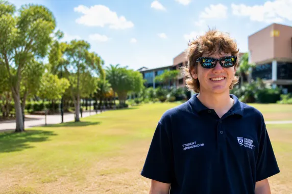 young man in sunglasses with CDU Open day written on the lenses