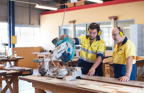 VET carpentry student and teacher