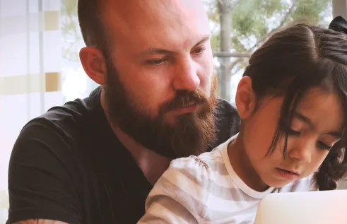 Father and daughter studying