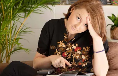 Katelyn Rossiter with social media devices.