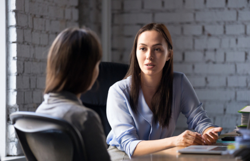 Professional female advisor speaking to a client