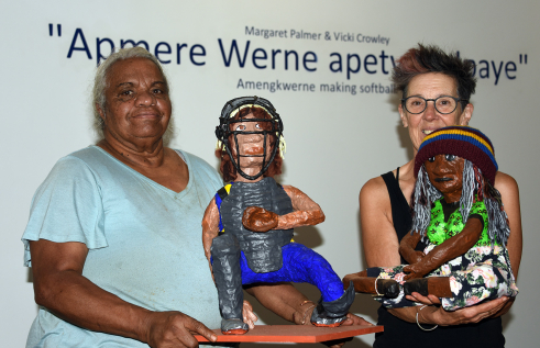 From left: Margaret Palmer and Vicki Crowley with two of the exhibition pieces: a player and one of the spectators. 